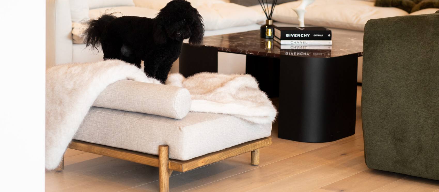 The Boujee Lounger dressed with a faux fur throw in a contemporary living room