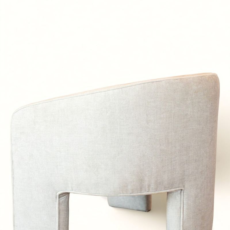 The continuous upholstered back of The Sit Pretty