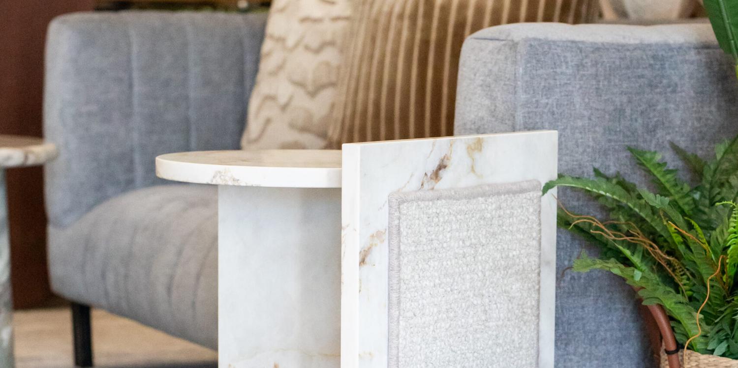The Boujee Side Table beside a sofa in a contemporary interior