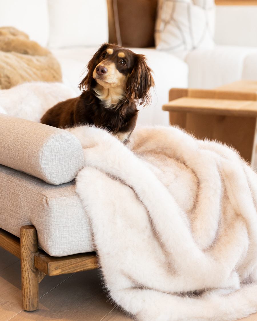 The throw draped over the arm of the Boujee Lounger